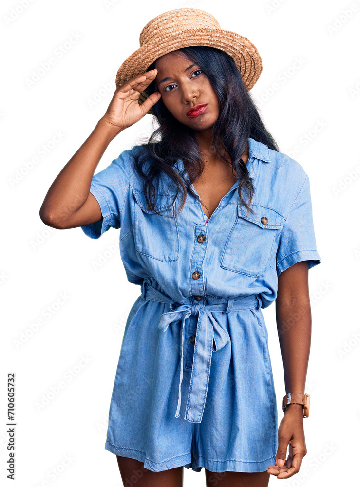 Young indian girl wearing summer hat worried and stressed about a problem with hand on forehead, nervous and anxious for crisis Young indian girl wearing summer hat worried and stressed about a problem with hand on forehead, nervous and anxious for crisis
