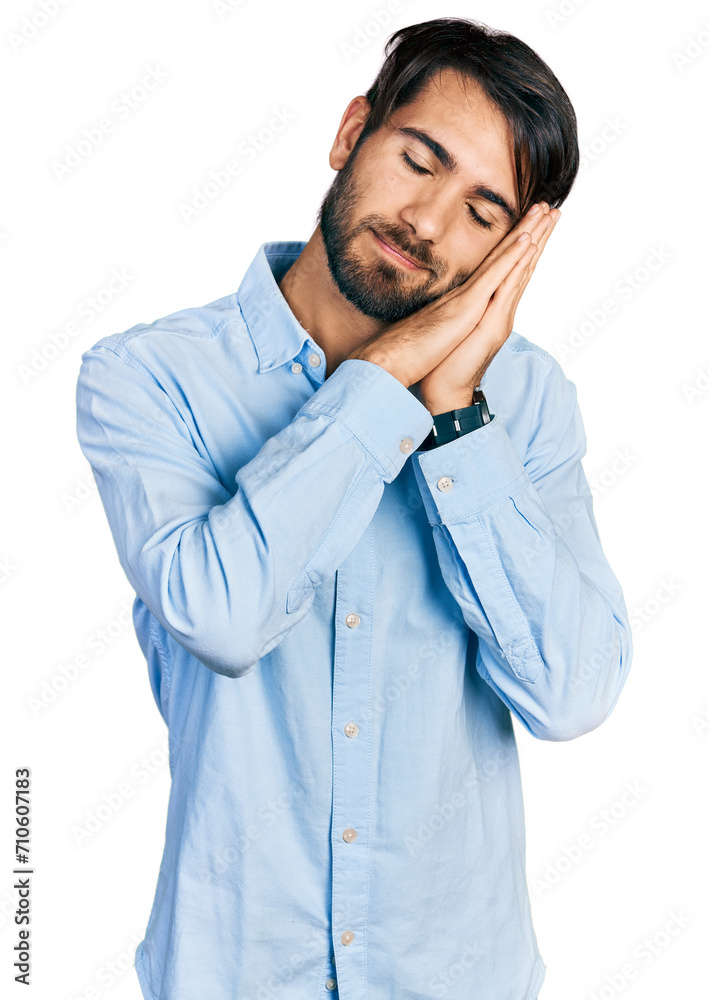 Hispanic man with blue eyes wearing business shirt sleeping tired dreaming and posing with hands together while smiling with closed eyes. Hispanic man with blue eyes wearing business shirt sleeping tired dreaming and posing with hands together while smiling with closed eyes.