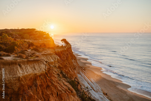 Amazing landscape of Falesia beach at sunrise, Algarve, Portugal photo