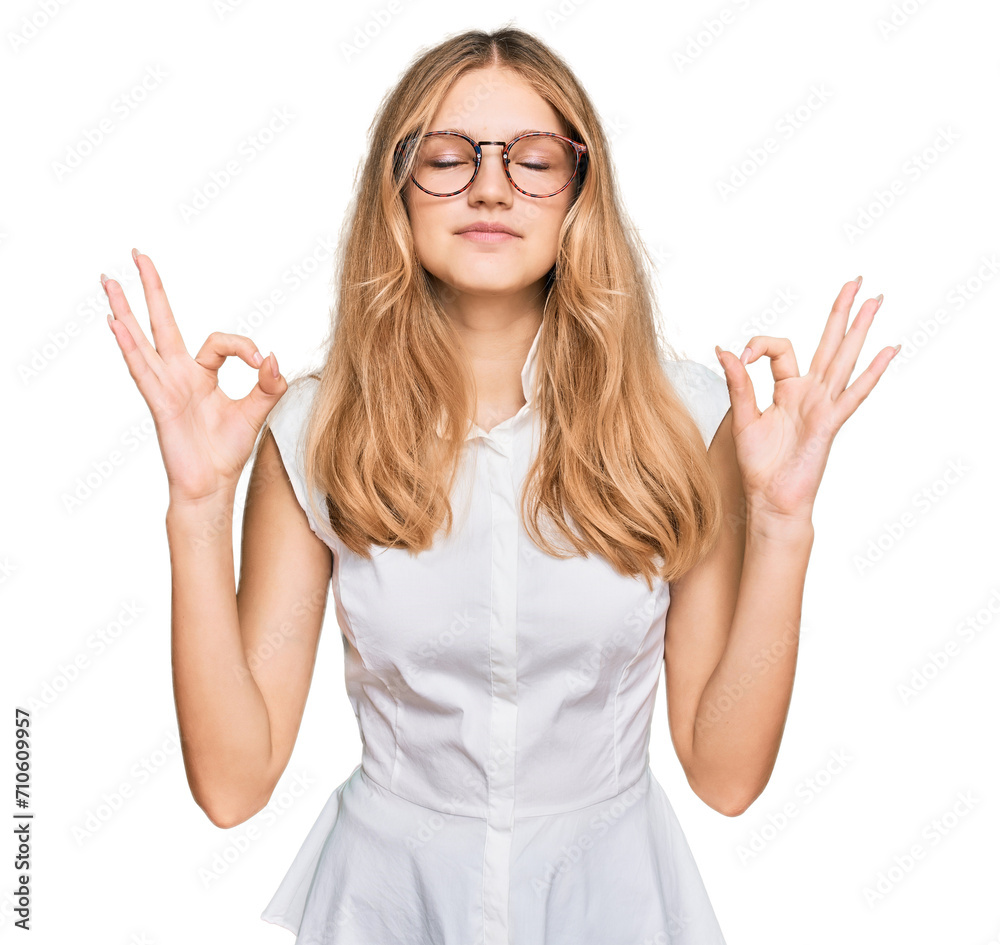 Beautiful young caucasian girl wearing casual clothes and glasses relax and smiling with eyes closed doing meditation gesture with fingers. yoga concept. Beautiful young caucasian girl wearing casual clothes and glasses relax and smiling with eyes closed doing meditation gesture with fingers. yoga concept.