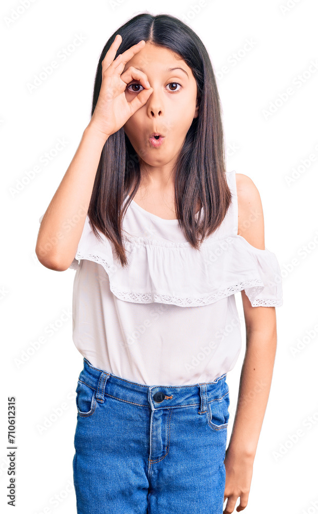 Beautiful child girl wearing casual clothes doing ok gesture shocked with surprised face, eye looking through fingers. unbelieving expression. Beautiful child girl wearing casual clothes doing ok gesture shocked with surprised face, eye looking through fingers. unbelieving expression.