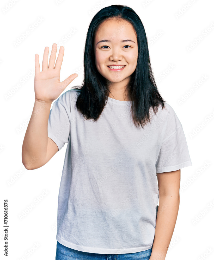 Young chinese woman wearing casual white t shirt showing and pointing up with fingers number five while smiling confident and happy. Young chinese woman wearing casual white t shirt showing and pointing up with fingers number five while smiling confident and happy.