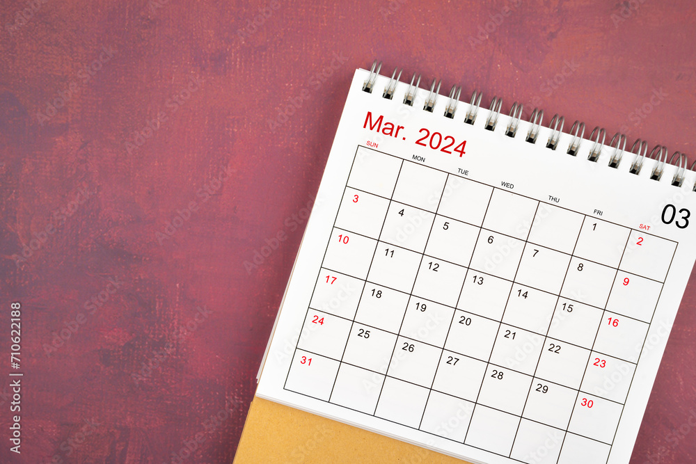 March 2024 desk calendar on red background. March 2024 desk calendar on red background.