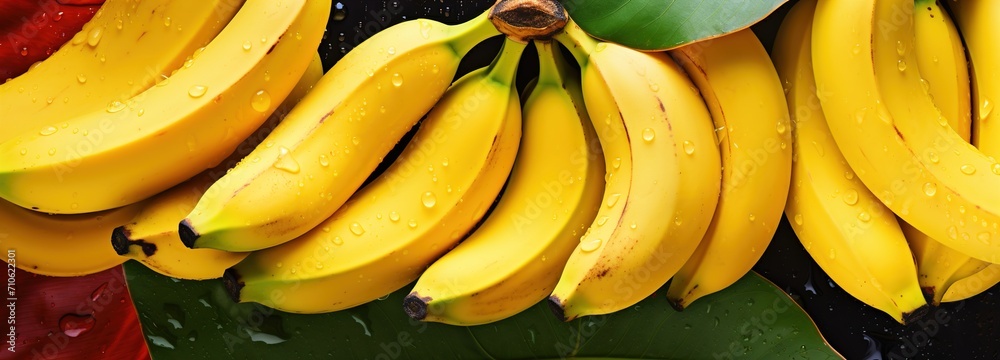 Closeup View of Fresh Yellow Bananas with Vibrant Leaves, A Tropical Delight - Ideal for Fruit Backgrounds and Natural Food Themes

