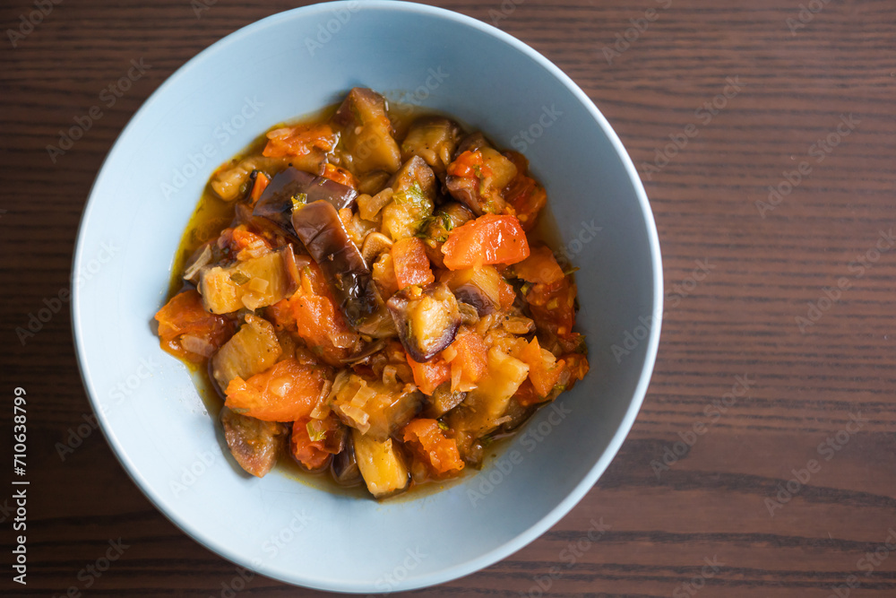 Soulful Comfort: Eggplant Stew in Blue Bowl Close-Up