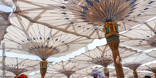 MEDINA, SAUDI ARABIA - APRIL 28 2018: These Umbrella construction on the square of Al-Masjid An-Nabawi or Prophet Muhammed 
