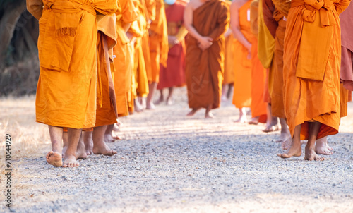 Monks walking for meditation, practicing religious physical exercises, performing religious ceremonies, dressing, praying.