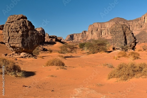 View of the Tadrart Rouge rocky mountain range in Tassili n Ajjer National Park. Sahara desert, Algeria, Africa.