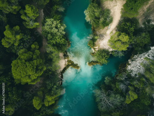Aerial drone view of beautiful turquoise water of the river in the forest