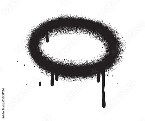 Black color spray paint or graffiti design element on the white wall background. Oval frame. 	