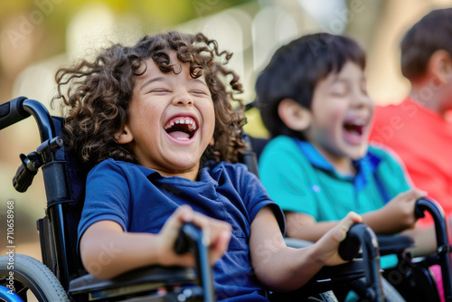 portrait of children in wheelchairs, laughing and talking happily