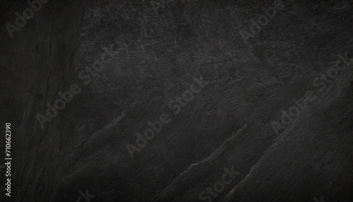 Black chalk board texture background.  Chalkboard  blackboard  school board  surface with scratches and chalk traces. Wide banner.