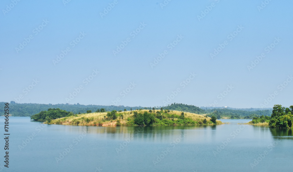 Famous alpine Scenic view of the lake, island and blue sky with clouds, outdoor travel background at Ayodha Hill, Purulia, in West Bengal, India.