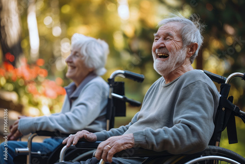 portrait of seniors in wheelchairs, laughing and talking happily © Kien