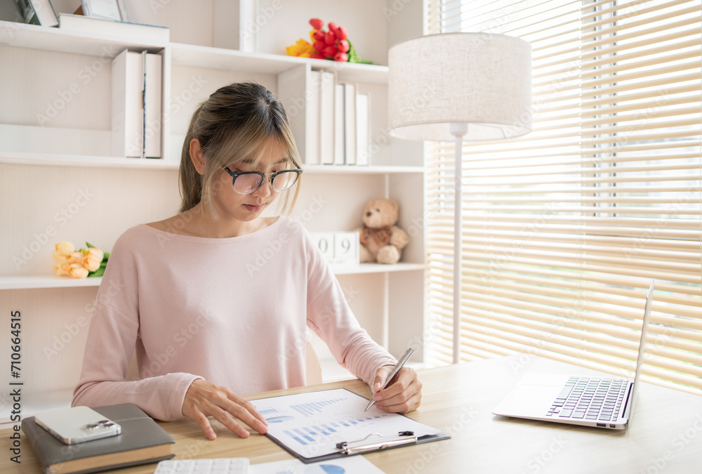 Employees working in the office, Businesswoman analyzes data graphs and works intently in his personal office, Businessman at Desk. Employees working in the office, Businesswoman analyzes data graphs and works intently in his personal office, Businessman at Desk.