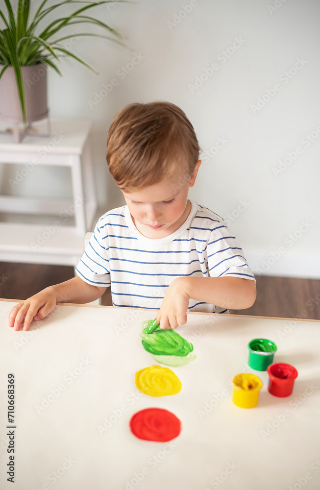 Caucasian Little Boy Painting with Colorful Hands Paints at Home Early Education Preparing for School Preschool Development Children Game Caucasian Little Boy Painting with Colorful Hands Paints at Home Early Education Preparing for School Preschool Development Children Game
