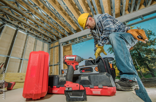 Construction Contractor Worker Preparing His Tools For a Job