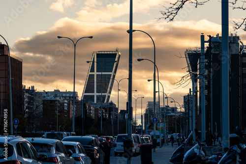 Cityscape at sunset of Paseo de la Castellana with apartment and office buildings in the city of Madrid in Spain photo