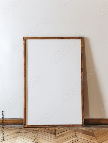 photo of a large blank frame leaning against a white wall. art mockup
