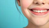 Girl smiling showing her healthy teeth. Concept of healthy teeth and oral hygiene, dentistry. Advertising for pediatric dentistry	