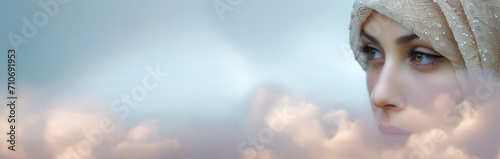 A Muslim woman in a hijab headscarf on a beautiful blurred background. A banner with an empty space for the text. photo