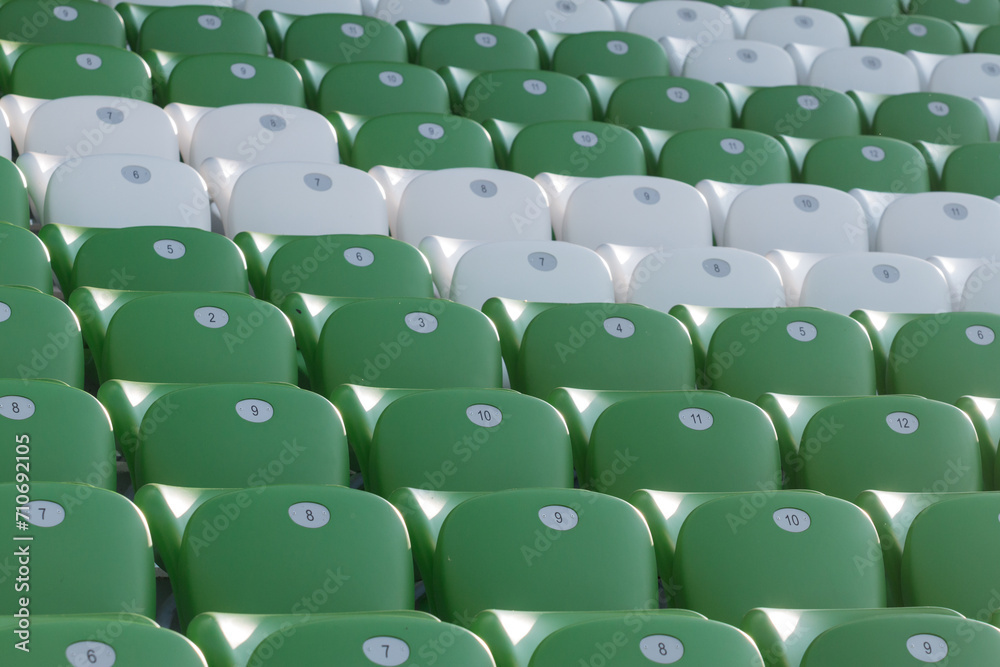 Obraz premium plastic green and white seats on football stadium