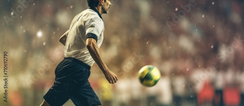 Assistant referee moving along the sideline during a soccer match. Soccer referee. Assistant football referee photo