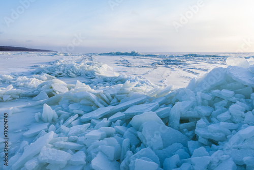 Landscape photo with ice hummocks and snow on a frozen Baltic Sea