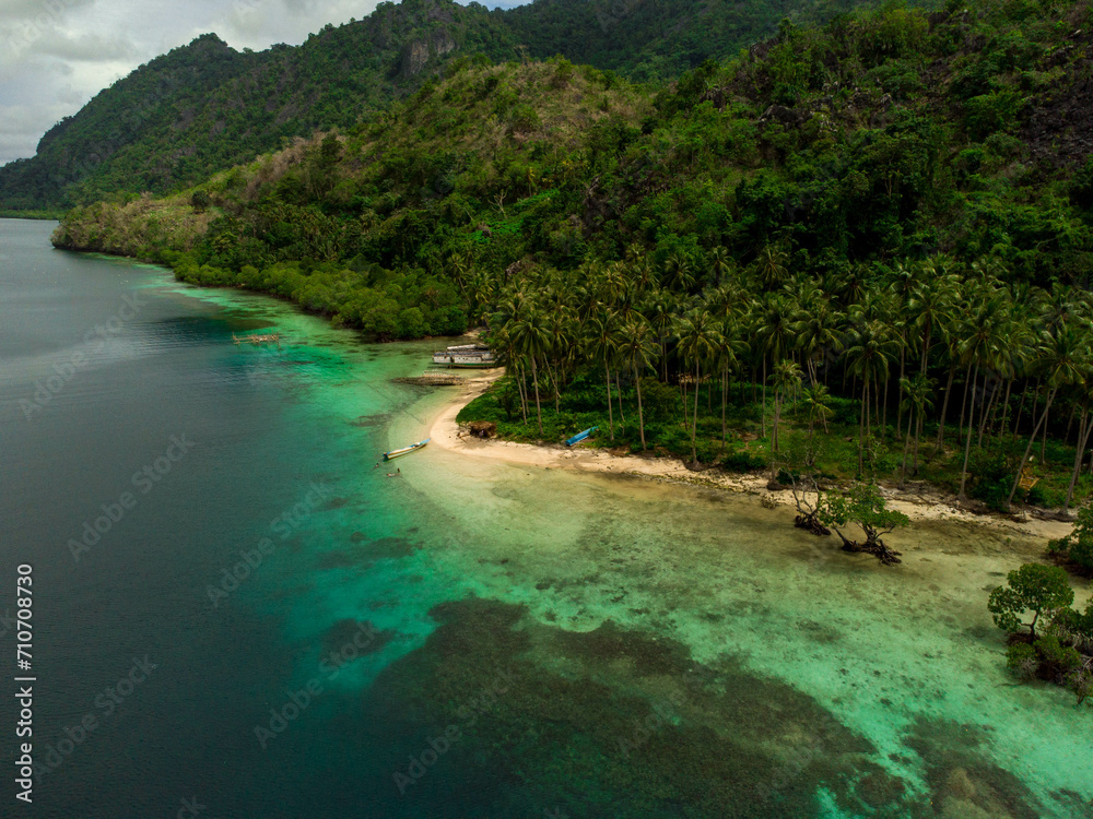 a small island surrounded by trees and water