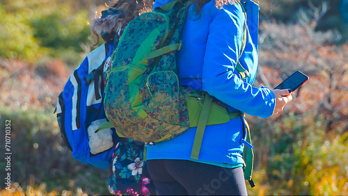 Detail women walking at laguna esmeralda hiking trail photo