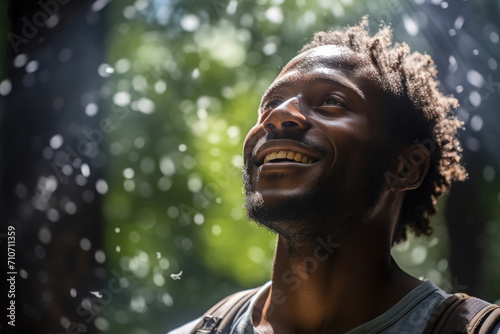 Joyful Man Enjoying Sunlight in Forest