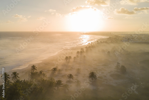 Aerial view of a long coastline with beach at sunset in Punta Cana, La Altagracia, Dominican Republic.