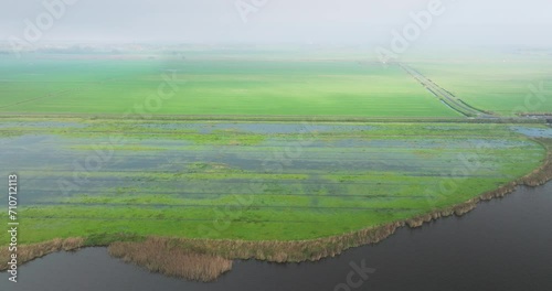 Aerial view of flooded grassland along lake in nature area Sondeler Leien, Sondel, Gaasterland, Friesland, Netherlands photo