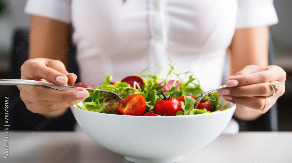 Radiant hands present a symphony of flavors and nutrients, captured in a plate of fresh herb salad. Radiant hands present a symphony of flavors and nutrients, captured in a plate of fresh herb salad.