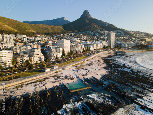 Aerial view of Milton tidal pool a popular swimming spot on the Sea Point Promenade with Lions Head mountain behind, Cape Town, South Africa.