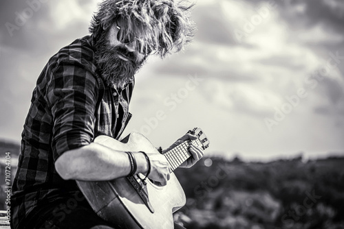 Acoustic guitars playing. Music concept. Guitars acoustic. Male musician playing guitar, music instrument. Black and white