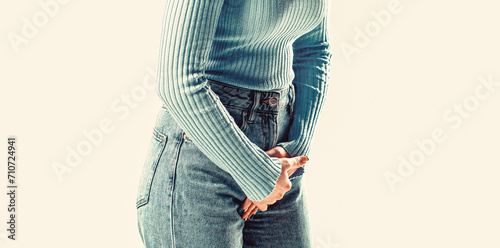 Closeup woman hands holding her crotch. Woman hands holding her crotch. Sick woman hands holding pressing her crotch lower abdomen photo