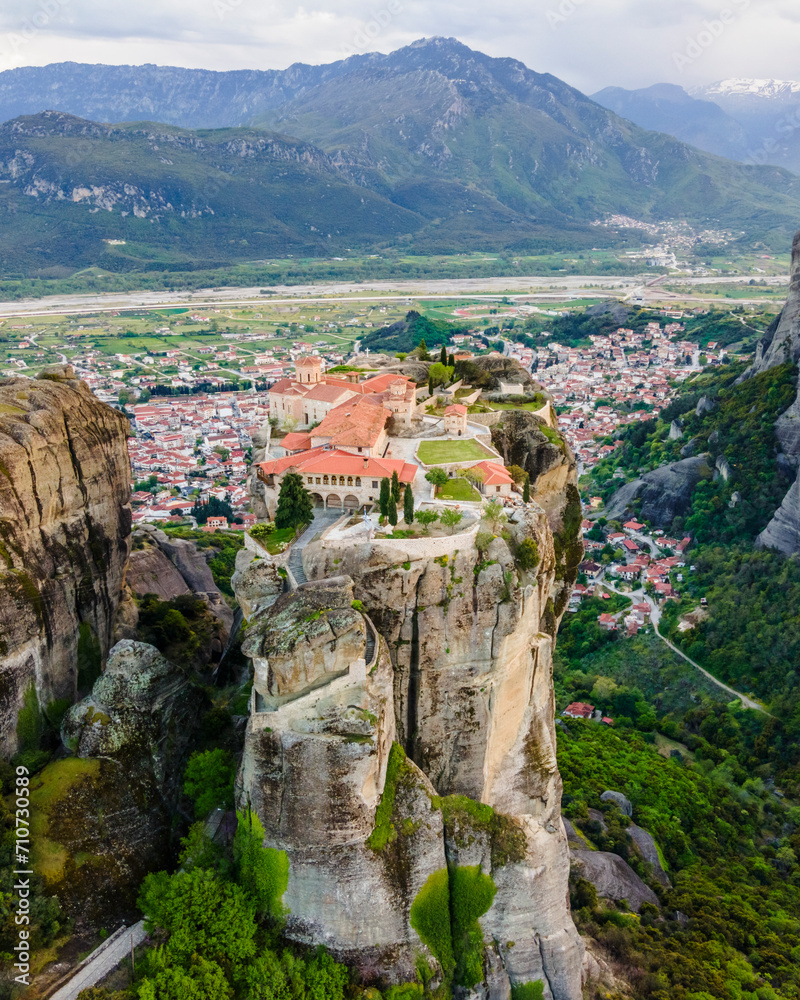 Aerial view of The Holy Trinity Monastery on natural rock formation, an ancient Eastern Orthodox monastery in Meteora, Kalabaka, Thessaly, Greece. Aerial view of The Holy Trinity Monastery on natural rock formation, an ancient Eastern Orthodox monastery in Meteora, Kalabaka, Thessaly, Greece.