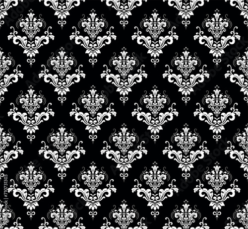 Wallpaper in the style of Baroque. Seamless vector background. White and black floral ornament. Graphic pattern for fabric, wallpaper, packaging. Ornate Damask flower ornament