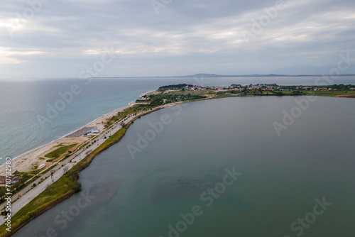 Aerial view of Fanari beach, a long stripe of land between Limnothalassa Ksirolimnis Lake and the Thracian Sea, East Macedonia and Thrace, Greece. photo