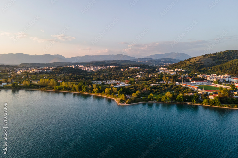 Aerial view of Igoumenitsa bay with mountains in background along the Ionian Sea, Epirus, Greece. Aerial view of Igoumenitsa bay with mountains in background along the Ionian Sea, Epirus, Greece.