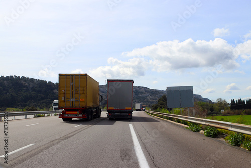 Overtaking trucks on a three lane highway from behind © Ines Porada