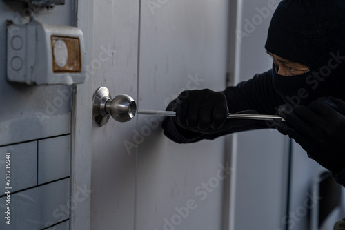 burglar attempting to break into a house photo