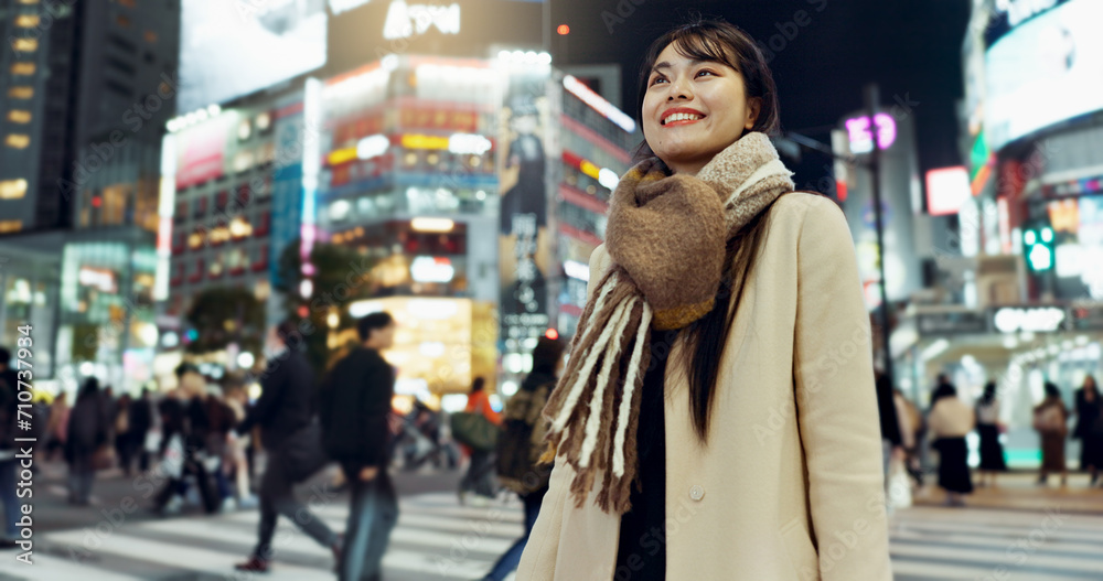 Night, walking and young woman in the town for exploring on vacation, adventure or holiday. Happy, travel and beautiful Asian female person by public transport for sightseeing on weekend trip in city Night, walking and young woman in the town for exploring on vacation, adventure or holiday. Happy, travel and beautiful Asian female person by public transport for sightseeing on weekend trip in city