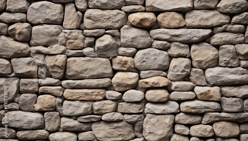 stone wall texture, grey and brown blocks, some rounds some rectangular 