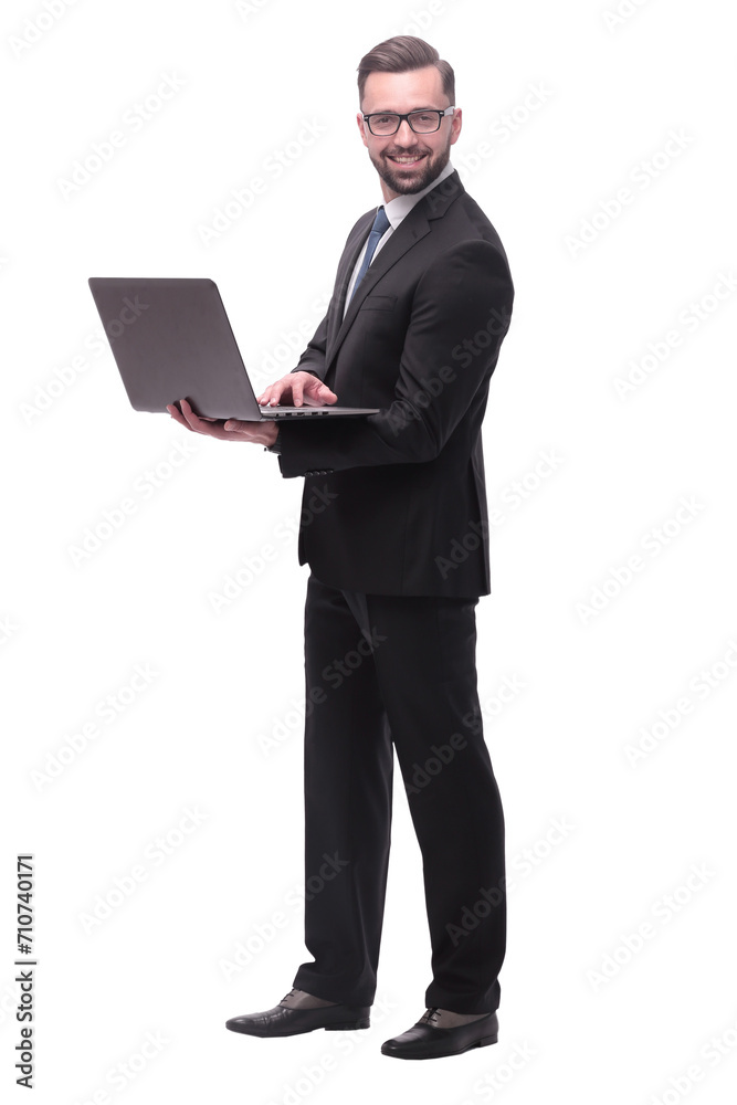in full growth. businessman with open laptop. in full growth. businessman with open laptop.