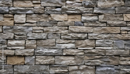 Modern style stone wall  uneven rectangular brown and grey blocks  