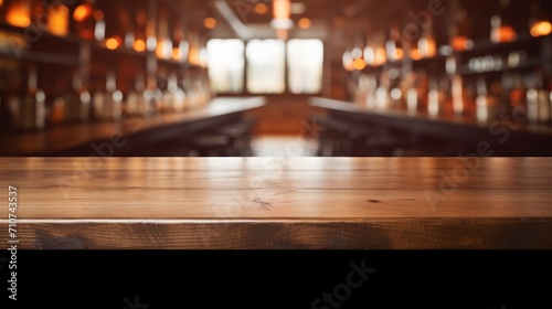  a close up of a wooden table with a blurry image of a room in the back ground behind it.