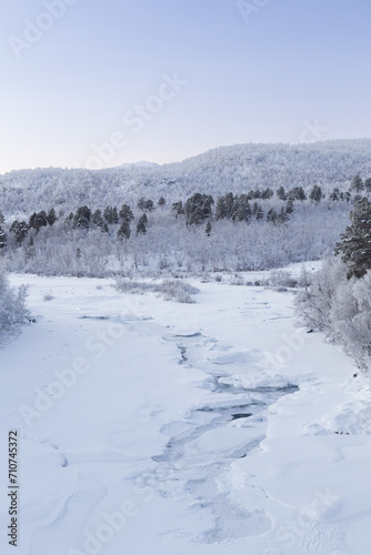 Frozen river in Abisko Nationalpark in winter scenery. Sweden, Arctic Circle, Swedish Lapland