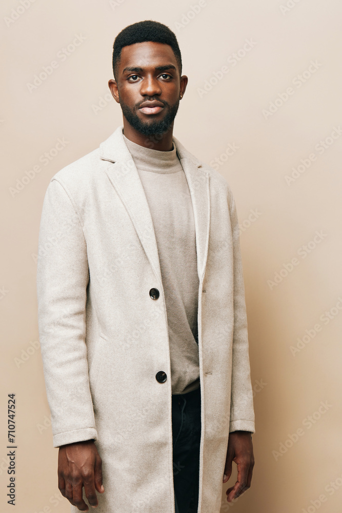 Obraz premium african man american grey black american background young guy portrait beige fashion african